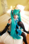 aqua_hair arai_yomi bed blouse cosplay detached_sleeves hatsune_miku headset pleated_skirt skirt thighhighs tie twintails vocaloid zettai_ryouiki rating:Safe score:0 user:nil!