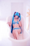 aqua_hair bathroom bathtub bikini cleavage cosplay hatsune_miku headset mashiro_yuki project_diva swimsuit twintails vocaloid rating:Safe score:0 user:nil!