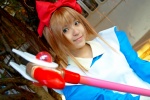 blonde_hair cardcaptor_sakura cosplay dress hairbow kinomoto_sakura natsu_yuki rating:Safe score:0 user:pixymisa