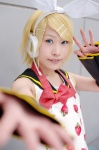apron blonde_hair cosplay detached_sleeves hairbow hair_clips hasui_yuuri headset kagamine_rin sailor_uniform school_uniform tagme_song vocaloid rating:Safe score:0 user:nil!