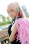 boots cosplay detached_sleeves headset megurine_luka pink_hair pom_poms sleeveless_blouse vocaloid yuu rating:Safe score:0 user:nil!