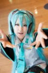 aqua_hair blouse cosplay detached_sleeves hatsune_miku headset himezonoroozu miniskirt pleated_skirt skirt tie twintails vocaloid rating:Safe score:0 user:pixymisa