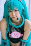 aira aqua_hair cosplay croptop elbow_gloves gloves hatsune_miku headset project_diva shorts sleeveless twintails vocaloid rating:Safe score:0 user:nil!