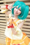armbands blouse bows cosplay green_hair macross macross_frontier mel_(cosplayer) microphone ranka_lee tiered_skirt twintails rating:Safe score:0 user:pixymisa