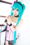 aqua_hair choker cosplay dress hairband hatsune_miku microphone momoiro_reku twintails vocaloid rating:Safe score:1 user:nil!
