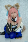 animal_ears caster cleavage collar cosplay detached_sleeves dress fate/extra fate/series fox_ears fox_tail pink_hair seri skirt skirt_train thighhighs rating:Safe score:1 user:pixymisa