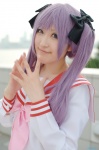 cosplay fumiko hair_ribbons hiiragi_kagami lucky_star purple_hair sailor_uniform school_uniform twintails rating:Safe score:0 user:nil!