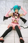 aqua_hair chii cleavage cosplay dress elbow_gloves fingerless_gloves gloves hairbows hatsune_miku project_diva stirrup_socks tail twintails vocaloid world_is_mine_(vocaloid) rating:Safe score:4 user:nil!