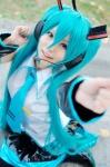 aice aqua_hair cosplay default_costume detached_sleeves hatsune_miku headset pleated_skirt skirt thighhighs tie twintails vocaloid rating:Safe score:1 user:nil!