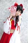 blouse cosplay detached_sleeves hairbow hakurei_reimu miko satori skirt touhou rating:Safe score:0 user:pixymisa