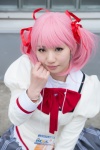 blouse bowtie cosplay hair_ribbons kaname_madoka kawabe_yuki pink_eyes pink_hair pleated_skirt puella_magi_madoka_magica skirt twintails rating:Safe score:0 user:pixymisa