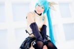 aqua_hair black_legwear cosplay croptop detached_sleeves hairbow hatsune_miku mashiro_yuki pleated_skirt ponytail project_diva skirt thighhighs vocaloid zettai_ryouiki rating:Safe score:0 user:nil!