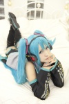 aqua_hair bed blouse cosplay detached_sleeves hatsune_miku headset pleated_skirt rito_akira skirt thighhighs tie twintails vocaloid zettai_ryouiki rating:Safe score:2 user:nil!