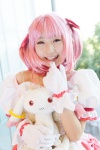 bows choker cosplay dress gloves hairbow kaname_madoka kujyou_konegi pink_hair plushie puella_magi_madoka_magica red_eyes tiered_skirt twintails rating:Safe score:0 user:pixymisa