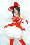 cosplay detached_sleeves dress dress_lift hairbow hakurei_reimu kishigami_hana miko thighhighs touhou zettai_ryouiki rating:Safe score:2 user:nil!