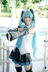 aqua_hair blouse cosplay detached_sleeves hatsune_miku headset pleated_skirt popuri skirt thighhighs tie twintails vocaloid zettai_ryouiki rating:Safe score:1 user:nil!