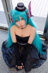 aqua_hair cleavage cosplay dress elbow_gloves fingerless_gloves gloves hatsune_miku headset strapless top_hat twintails vocaloid yane rating:Safe score:0 user:pixymisa