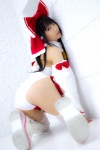 ass bodysuit boots cosplay detached_sleeves hairbow hakurei_reimu kneepads lenfried miko thighhighs touhou rating:Safe score:5 user:nil!