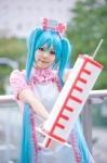 aqua_hair cosplay hatsune_miku hiroyuki koiiro_byoutou_(vocaloid) nurse nurse_cap nurse_uniform syringe twintails vocaloid rating:Safe score:0 user:pixymisa