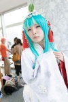 aqua_eyes cosplay hatsune_miku hood maitako multi-colored_hair robe tassels vocaloid rating:Safe score:0 user:pixymisa