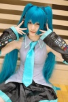 aqua_hair cosplay default_costume detached_sleeves hatsune_miku headset hina pleated_skirt skirt tie twintails vocaloid rating:Safe score:0 user:nil!