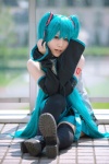 aqua_hair ayaki blouse cosplay detached_sleeves hatsune_miku headset pleated_skirt skirt thighhighs tie twintails vocaloid zettai_ryouiki rating:Safe score:1 user:nil!