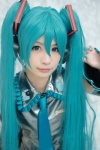 aqua_hair cosplay detached_sleeves hatsune_miku headset tie twintails uta vocaloid rating:Safe score:0 user:pixymisa