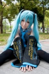 aqua_hair blouse cosplay detached_sleeves hatsune_miku headset pleated_skirt sanaka skirt thighhighs tie twintails vocaloid rating:Safe score:1 user:pixymisa