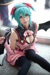 aqua_hair cleavage cosplay dress elbow_gloves fingerless_gloves gloves hatsune_miku headset leggings project_diva ryuga tail vocaloid wings world_is_mine_(vocaloid) rating:Safe score:8 user:nil!