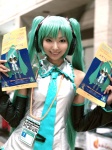 aqua_hair cosplay default_costume detached_sleeves hatsune_miku headset necoco tie twintails vocaloid rating:Safe score:0 user:nil!