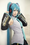 aqua_hair blouse cosplay detached_sleeves hatsune_miku headset pleated_skirt rito_akira skirt tie twintails vocaloid rating:Safe score:1 user:nil!