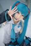 aqua_hair blouse cosplay detached_sleeves hatsune_miku headset pleated_skirt rinami skirt thighhighs tie twintails vocaloid rating:Safe score:1 user:pixymisa