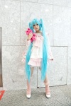 aqua_hair bow cosplay dress hatsune_miku kneesocks lots_of_laugh_(vocaloid) plushie rushi twintails vocaloid rating:Safe score:3 user:pixymisa