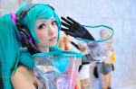 aqua_hair cosplay croptop detached_sleeves elbow_gloves gloves hatsune_miku headset jiruko project_diva twintails vocaloid rating:Safe score:1 user:nil!
