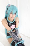 aira aqua_hair boots cosplay croptop detached_sleeves elbow_gloves gloves hatsune_miku headset pantyhose project_diva shorts thigh_boots thighhighs twintails vocaloid rating:Safe score:1 user:xkaras