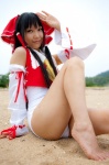 barefoot beach cosplay detached_sleeves hairbow hakurei_reimu lenfried one-piece_swimsuit swimsuit touhou rating:Safe score:0 user:nil!