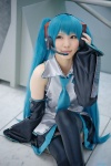 aqua_hair blouse cosplay detached_sleeves hatsune_miku headset pleated_skirt rinami skirt thighhighs tie twintails vocaloid rating:Safe score:3 user:pixymisa