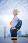 blonde_hair blouse blue_eyes cosplay crossplay detached_sleeves headset kagamine_len mogeta scarf_tie shorts vocaloid rating:Safe score:0 user:pixymisa