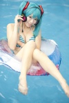 aqua_hair barefoot bikini cleavage cosplay hatsune_miku headset inner_tube mashiro_yuki pool project_diva swimsuit twintails vocaloid wet rating:Safe score:10 user:nil!