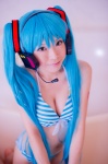 aqua_hair bathroom bathtub bikini cleavage cosplay hatsune_miku headset mashiro_yuki project_diva swimsuit twintails vocaloid rating:Safe score:0 user:nil!