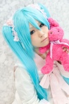 aqua_hair bow cosplay dress hatsune_miku lots_of_laugh_(vocaloid) plushie rushi twintails vocaloid rating:Safe score:0 user:pixymisa