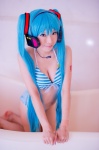 aqua_hair bathroom bathtub bikini cleavage cosplay hatsune_miku headset mashiro_yuki project_diva swimsuit twintails vocaloid rating:Safe score:0 user:nil!