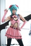 aqua_hair cleavage cosplay dress elbow_gloves fingerless_gloves gloves hatsune_miku headset leggings project_diva ryuga tail vocaloid wings world_is_mine_(vocaloid) rating:Safe score:9 user:nil!