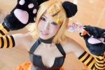 animal_ears blonde_hair cat_ears cat_paws cosplay detached_sleeves hair_clips halter_top kagamine_rin paw_gloves pleated_skirt skirt striped tomoshibi vocaloid rating:Safe score:1 user:pixymisa