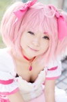 bows choker cleavage cosplay dress gloves hairbows kaname_madoka mumuko pink_hair puella_magi_madoka_magica twintails rating:Safe score:0 user:pixymisa