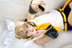 blonde_hair cosplay default_costume detached_sleeves hairbow hair_clips headset kagamine_rin kipi sailor_uniform school_uniform shorts vocaloid rating:Safe score:2 user:nil!