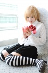 amane_misa apple blonde_hair cosplay death_note kipi striped thighhighs zettai_ryouiki rating:Safe score:5 user:c0rtana