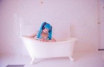 aqua_hair bathroom bathtub bikini_top cleavage cosplay hatsune_miku headset mashiro_yuki project_diva swimsuit twintails vocaloid rating:Safe score:0 user:nil!