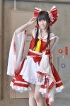 cosplay croptop detached_sleeves hairbow hakurei_reimu miko miniskirt popuri skirt touhou rating:Safe score:3 user:nil!