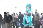 aqua_hair cosplay default_costume detached_sleeves hatsune_miku headset iori pleated_skirt skirt thighhighs tie twintails vocaloid zettai_ryouiki rating:Safe score:1 user:nil!